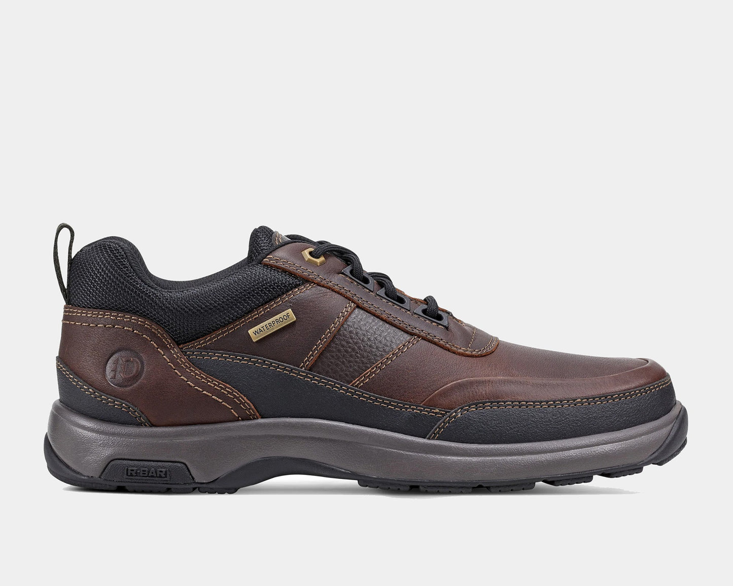 A pair of brown, waterproof, casual style Dunham 8000 Country Low Lace-up boots with a lace-up closure and a padded collar.