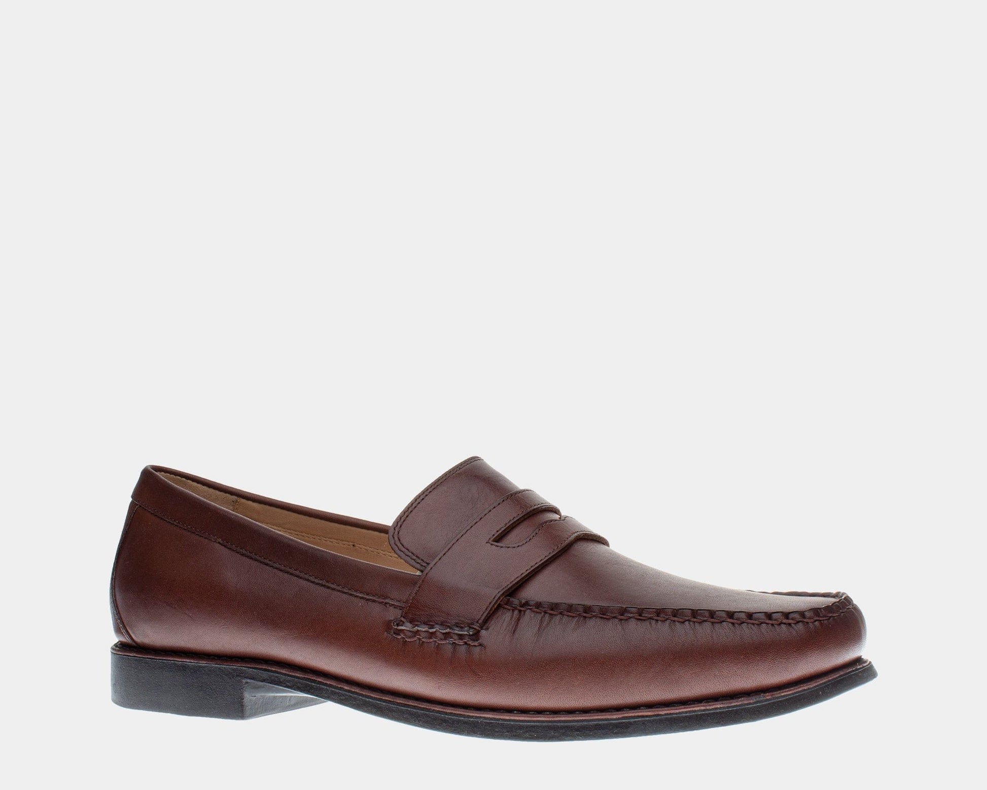 A brown full-grain leather penny loafer with a slip-on construction and sheepskin lining.