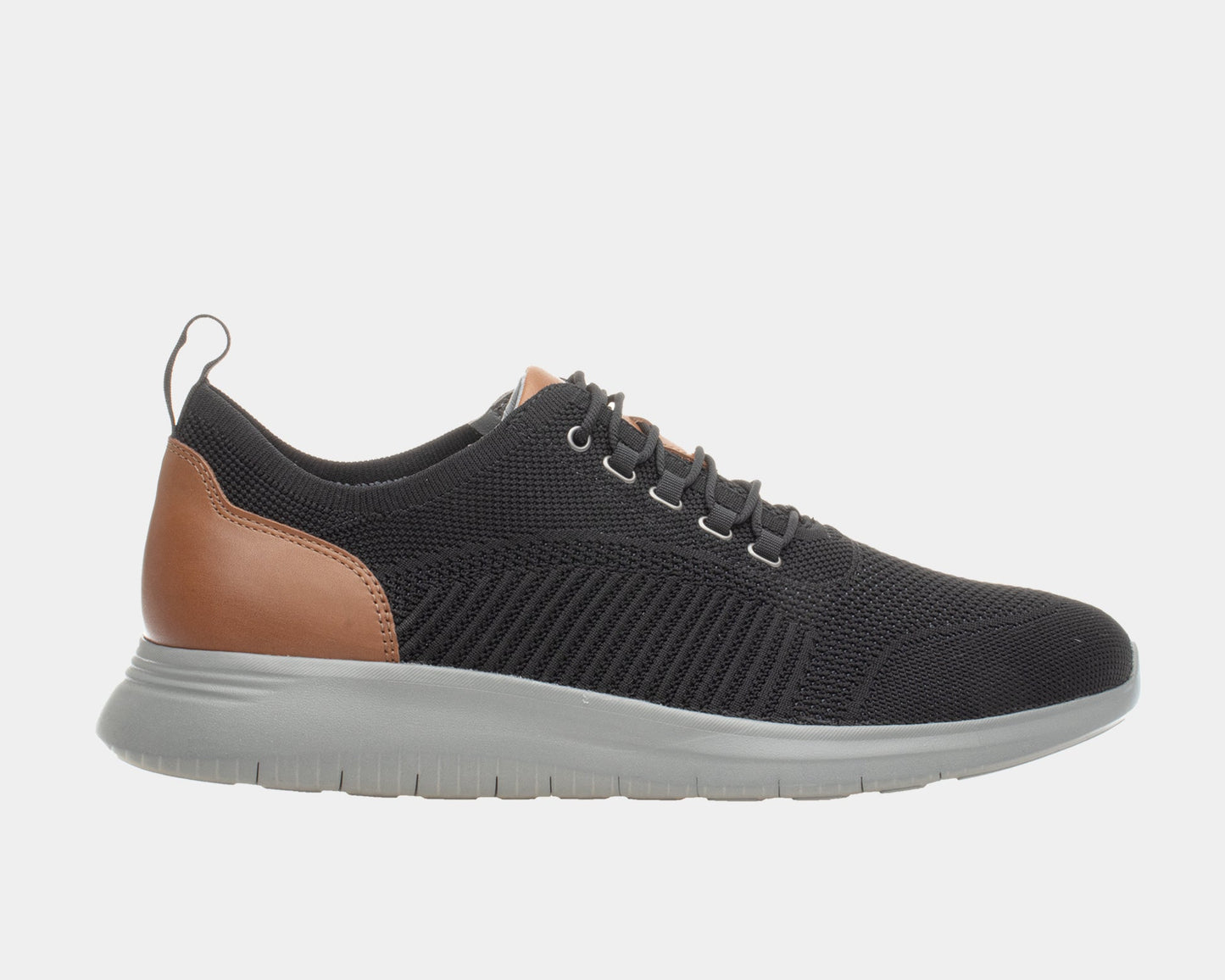 A black dress casual style knit shoe with a leather trim and a low heel design on a flat sole.