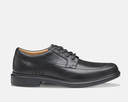 A black, waterproof, full grain leather upper shoe with a lace-up closure, featuring a seam-sealed construction and a durable rubber outsole.