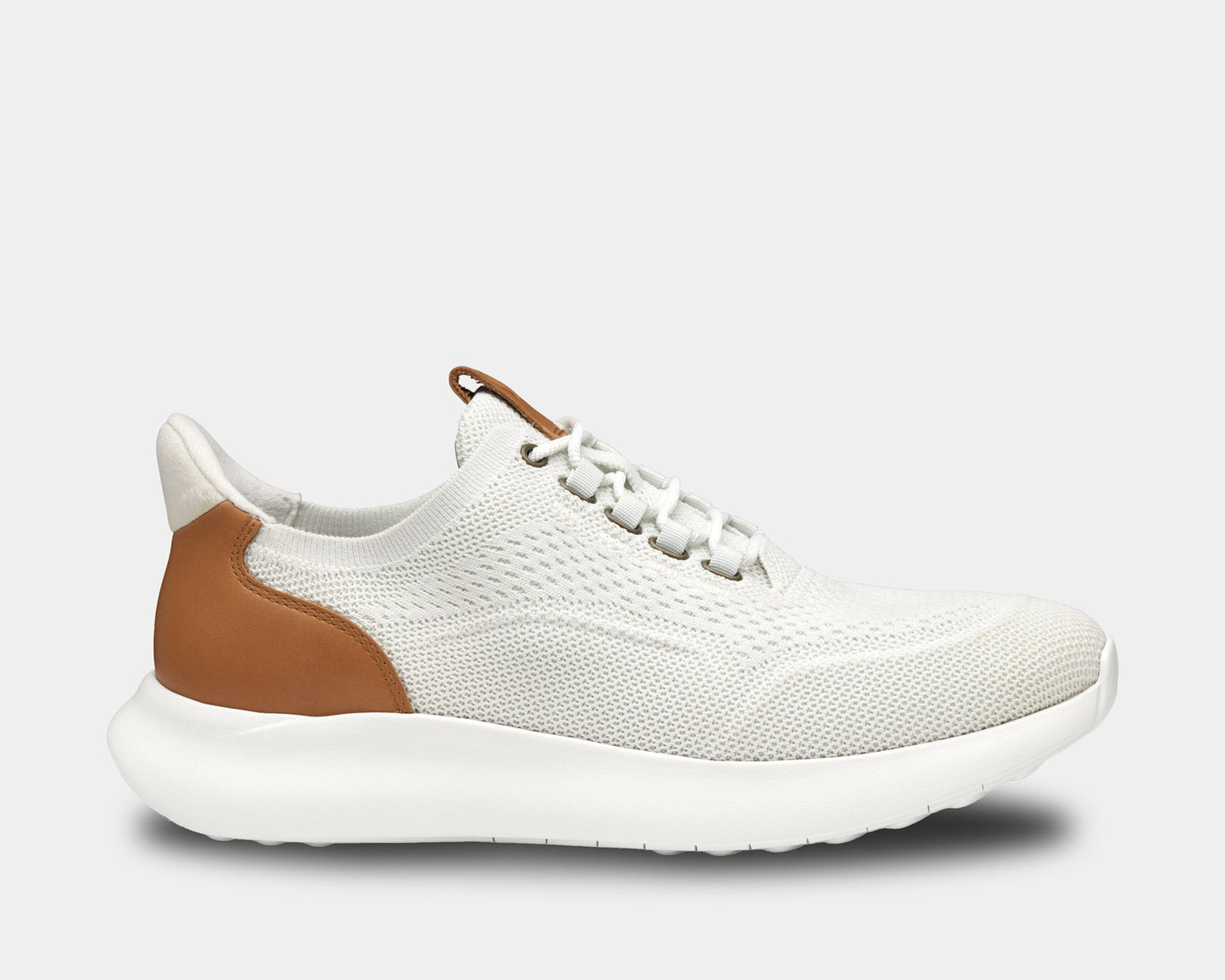 A pair of low-top athletic style knit sneakers with a plain toe design, featuring a white heathered knit fabric, brown leather trim, and a tan heel counter.