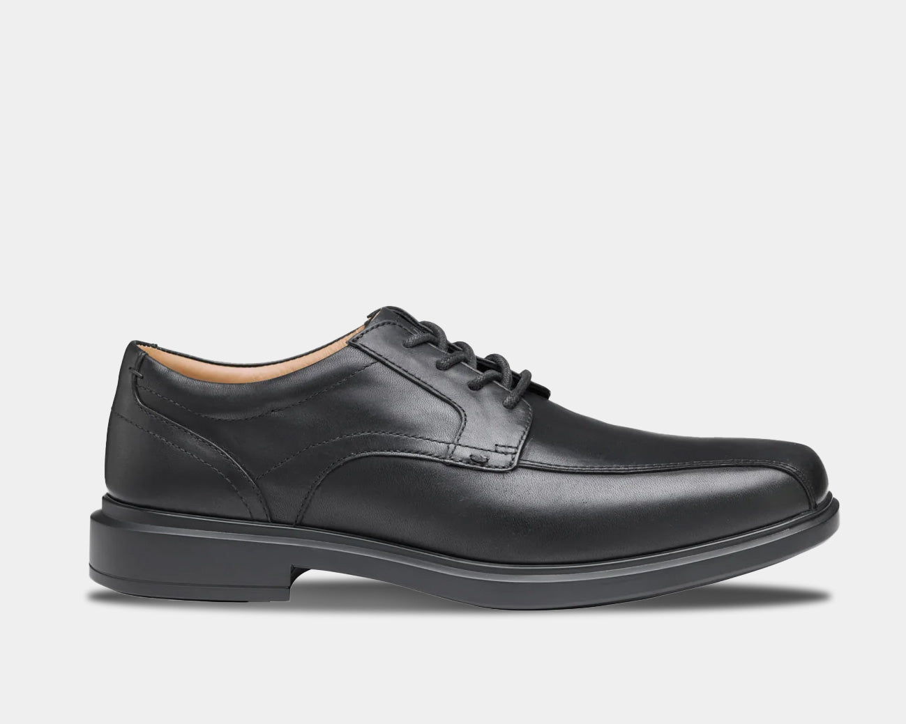 A black, lace-up Oxford dress shoe with a low heel and rubber outsole.