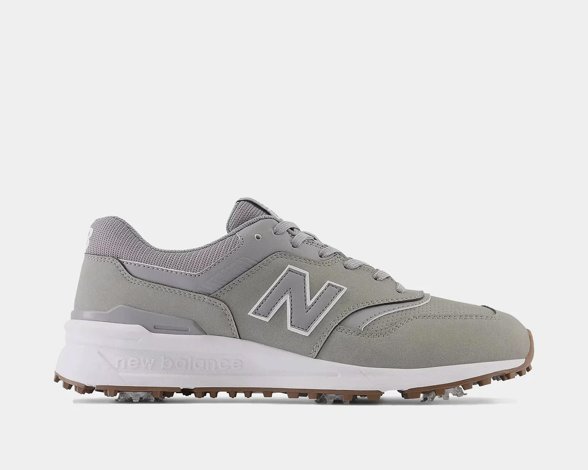 A pair of New Balance 997 golf shoes in gray and white with a waterproof microfiber leather upper and FastTwist 3.0 removable Pulsar cleats.