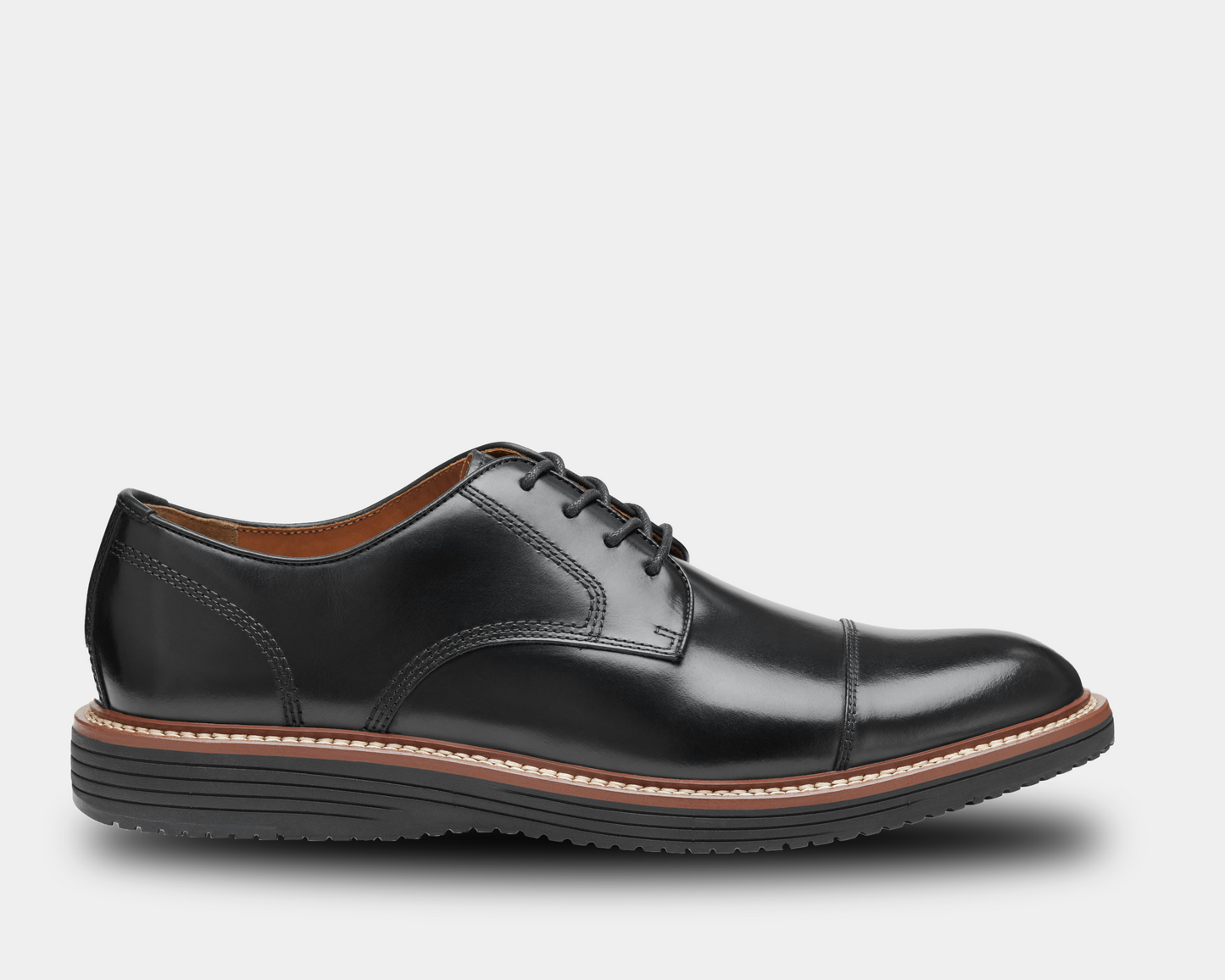 A black full-grain leather cap toe shoe with a light brown mesh lining, featuring a leather and mesh combination sole.
